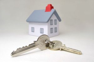 Buying a house - cgi house with keys in the forefront